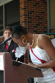 Dana Valeary (foreground), NHPC President, signs the Declaration of Civility as Ron Sapia (background), SGA vice president, stands back and watched the event.