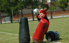 Greg Casnave, senior defensive lineman, does drills at practice on August 16th.