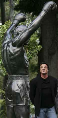 Actor Sylvester Stallone stands next to the bronze statue portraying the boxer Rocky Balboa from the film Rocky III after it was unveiled near the steps of the Philadelphia Museum of Art, Friday.
