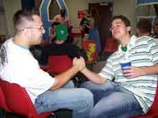 Theta Xi's Jason Fischtziur, business senior from Kenner, gives a hand shake to rushee Chris Lovell, freshman from Houma, during IFC rush last week.