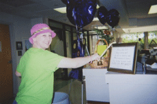 Jessica Cassard, Nicholls alumna and graduate student, rings a bell to signify her last day of chemotherapy in May 2005 at Ochsner Foundation Hospital in New Orleans.