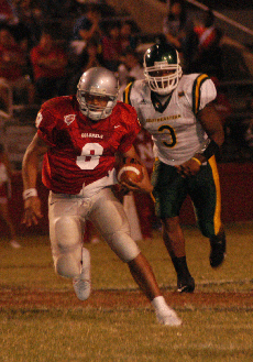 Freshman quarterback Vincent Montgomery runs from a Southeastern defender in the Colonels 14-10 Homecoming victory over Southeastern Oct. 7.			 