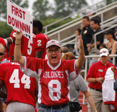 Mike Smith, the First Down Man, celebrates after Nicholls makes a first down. 