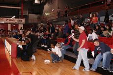 The crowd cheers for the men's basketball team in the new seating reserved for students during a Jan. 12 game against University of Texas at Arlington in Stopher Gym.