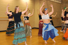 Liz Dominy from Thibodaux, Daisy Driest from Thibodaux, and Jennifer Breaux from St. Charles-Community, participate in belly dancing class at Shaver Gym Monday.