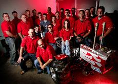 Students of the manufacturing engineering technology degree program at Nicholls  pose with the quarter-scale tractor they built for competition. The degree program was recently terminated by the Board of Regents, but has since been reinstated.