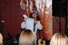 James Carrier of Lafayette, in character as Poo Poo Broussard, reads his PooPooisms at Zack's Frozen Yogurt in Thibodaux Saturday. PooPooisms are life advice, Poo Poo-style. 