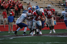 Senior fullback Cole Broderick breaks through a block during Saturday's game against Southern Arkansas. The Colonels defeated the Muleriders 31-13 in the home opener. Historically, the Colonels are 25-10 in home openers.