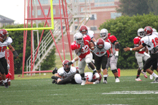 Senior fullback Joseph Tobias breaks a run in the victory over Azusa Pacific Saturday in John L. Guidry Stadium. 