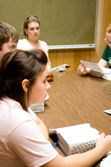 Sierra Trosclair (foreground), elementary education sophomore from Houma, reads and discusses the Old Testament in a study room at Ellender Memorial Library Oct. 9 with (clockwise) Michael Dardar, an L.E. Fletcher student from Cutoff, Kristen Dardar, an L