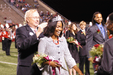 University President Stephen Hulbert crowns the 2007 Homecoming Queen Stacy Ann Smith, psychology senior from Jamaica, while Homecoming King Kenneth Temple looks on during halftime of the football game Saturday night in John L. Guidry Stadium.