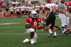 Senior fullback Broderick Cole kneels between plays during the Azusa Pacific game Sept. 22 in John L. Guidry Stadium.