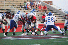 Colonels senior fullback Broderick Cole runs past Southern Arkansas defenders during the game Sept. 8 in John L. Guidry Stadium. 