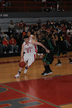 Junior forward Ryan Bathie attemps to dribble past  a Southeastern  Louisiana University defender Saturday in Stopher Gym with support from teammate freshman guard Anatoly Bose. The Colonels beat the Lions 80-66.