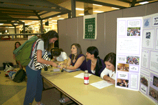 Brittany Collongues, freshman from Slidell; Roychelle Cheramie, freshman from Galliano and Jessica Blanchard, freshman from Napoleonville, celebrate Badge Day by talking to interested students about the badge of Sigma Sigma Sigma Monday in the Bollinger M