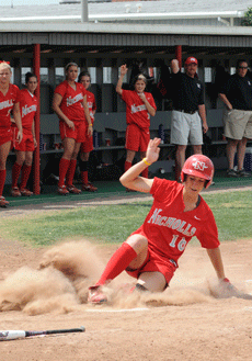 Freshman third baseman Tori Lay slides into home plate during the March 30 game against University of Texas-San Antonio at the softball field.