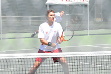 Junior Vlad Popa stands at ready for Lamar's serve while his partner, freshman Radu Ionescu, behind him on Tuesday, April 15.