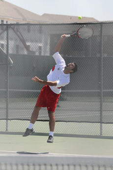 Senior Alex Gasca-Silav jumps up for a volley against Southeastern April 15 on the Nicholls' tennis courts during his match against Southeastern.