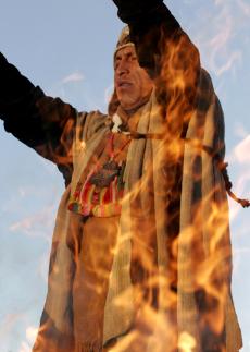 A shaman is seen through flames as he performs a ritual during celebrations of the Aymara New Year at the ancient ruins of Tiwanaku, Bolivia, June 21.