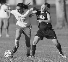 Junior midfielder Caitlyn Donegan tries to lose an LSU Shreveport defender during a match.