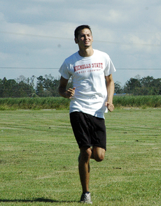 Sophomore Brandon Kotzur runs in the field for practice.