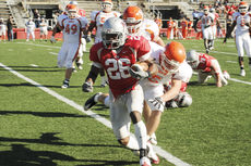 Senior Colonels running back Isa Hines avoids a tackle and runs for the goal line to score a touchdown during the match against Sam Houston University Saturday in John L. Guidry Stadium. Hines scored two touchdowns during the game.