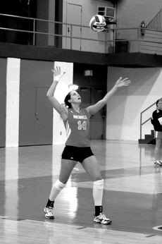 Senior outside hitter Mallory McInnis prepares to serve the ball during the match vs. Northwestern.
