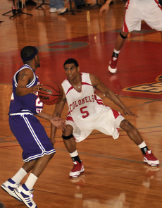 Justin Payne plays offense against Northwestern State at the Saturday night game in Stopher gym. The Colonels performed well against the Northwestern State Demons, scoring 85 points to Northwesterns 69, repeating their victory from the 2007 season.