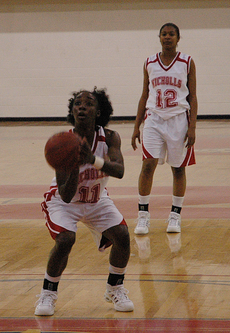 Senior Tiffany Jones attempts to make a goal as freshman Danielle Douglas looks on during Saturdays game against Northwestern State. The Lady Colonels played hard, but were unable to pull off a victory. Their next game is Saturday in Stopher Gym against 