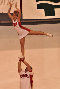Nicholls cheerleaders warm up the crowd during a basketball game inside Stopher Gym. Spirit groups have requested a self-assessed fee to help fund spirit activities at Nicholls.