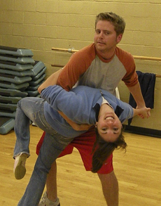 Brandon Rizzuto, director of sports information, dips Candace Park, student services counselor, during the continuing education course Lets Dance.  The course, taught by Angela Hammerli, distinguished service professor of teacher education is held on M