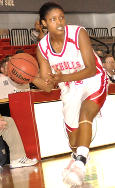Senior forward Dominique Washington prepares to pass the ball in Wednesdays game against Sam Houston State. The Lady Colonels won 76-74.