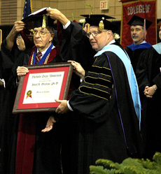 Alfred Delahaye, professor emeritus of journalism, was presented an honorary degree by University President Stephen Hulbert at the Fall 2008 Commencement ceremony inside the Houma Civic Center.