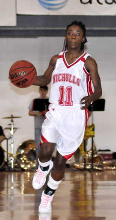 Nicholls senior guard Tiffany Jones dribbles down the court on offense.