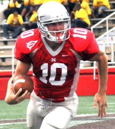 Redshirt freshman quarterback Jacob Witt tries to keep the offense alive by making a 20-yard run during Saturdays game against Duquesne.