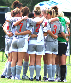 The soccer team huddles together before the Aug. 30th game against Troy University.  The Colonels lost 3-2.