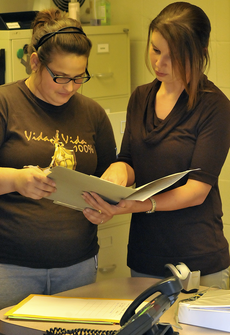Lindsey Scott (left), sociology freshman from Chauvin, discusses exam schedules with Director of Disability Services Stacey Guidry Monday at the Office of Disability Services in Peltier Hall.