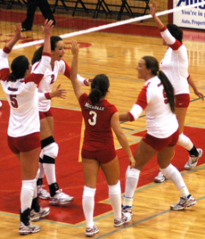 The team celebrates after scoring a point during Friday's game against Southeastern.  The Colonels lost 3-1.