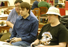 Michael Prehn, culinary senior from Mandeville; Justin Sumrall, from Houma; and Ben Heck, art sophomore from Thibodaux, play in BlazBlue tournament last Thursday.