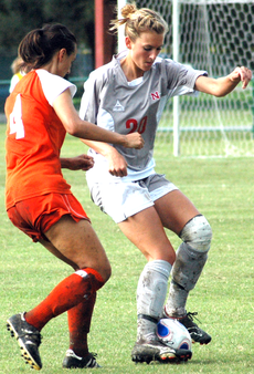 Junior midfielder/defender Gillian McCarter battles a Houston Baptist player for the ball during Friday's game.  The Colonels lost 3-0.