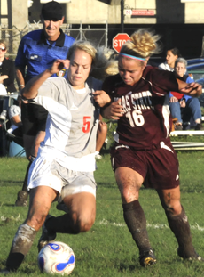 Junior defender Allison Mylius fights a Texas State player for the ball during Fridays game.  The Colonels lost 3-1.