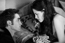 Robert Pattinson and Kristen Stewart star as vampire Edward Cullen and his human love interest Bella Swan in The Twilight Saga