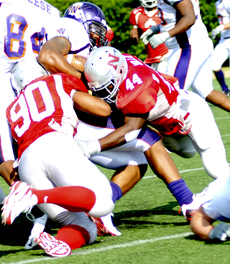 Senior defensive end Zac Reddix (90) and junior linebacker Yashua Willis (44) take down a Northwestern State player during Saturdays game.  The Colonels won 28-21.