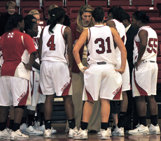 Head womens basketball coach DoBee Plaisance, center, explains strategies to the team during the Dec. 17th game against Southern University. 