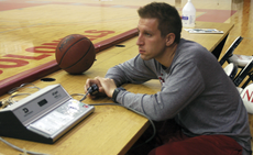 Graduate assistant mens basketball coach Andrew Kearney supervises practice Tuesday in Stopher Gym.
