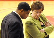 Assistant womens basketball coaches Justin Payne and Louise Do Bonin talk during the Jan. 20th game against Central Arkansas.