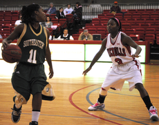 Junior guard Ricshanda Bickham tries to block a Southeastern University player during the Feb. 13 game.  The Colonels lost 72-68.