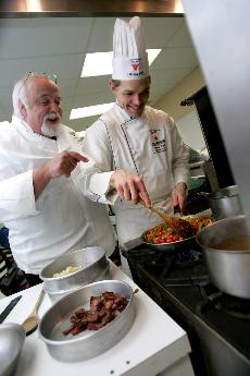 Randy Cheramie (left), associate dean of the John Folse Culinary Institute, and Johnathan Lynch, culinary arts junior from Ruston, practice for the Mystery Basket Competition - part of the San Pellegrino Almost Famous Chef Competition in Napa Valley, Cali
