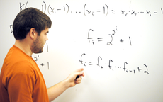 Grant Boudreaux, mathematics junior from Thibodaux, demonstrates results related to Lehmers Equation Monday as part of the College of Arts and Sciences Research Week presentations.