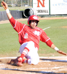 Junior infielder Chase Jaramillo slides into home base during the March 13 game against Lamar University.